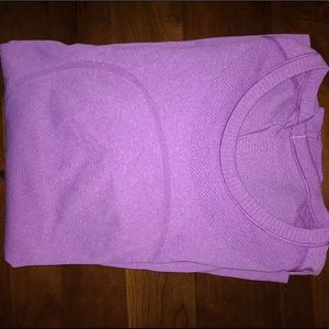 Long sleeved Lululemon shirt with thumb holes.